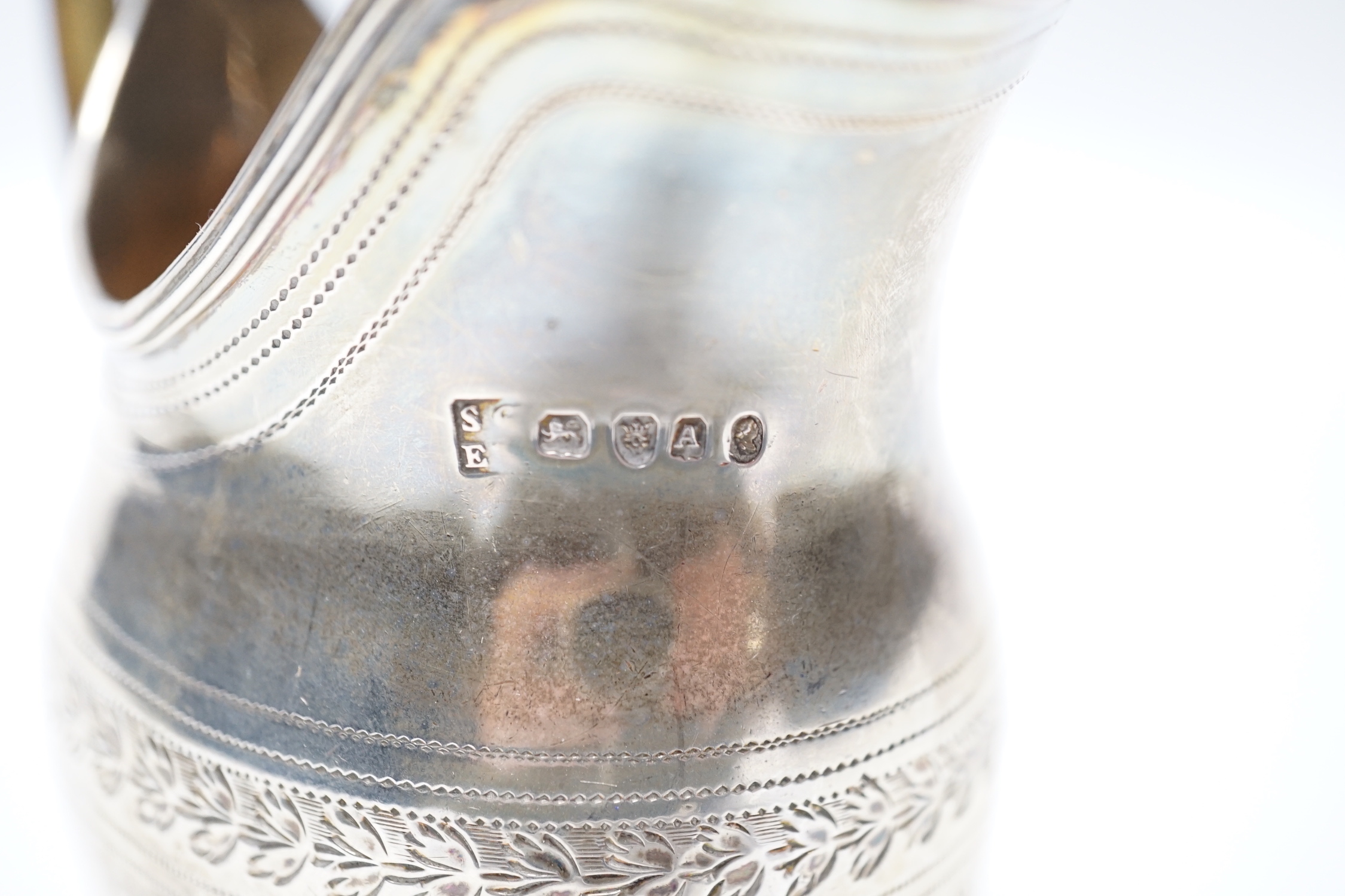 A George III silver engraved helmet shaped cream jug, Godbehere & Wigan, London, 1796, 10cm, 5.3oz.
